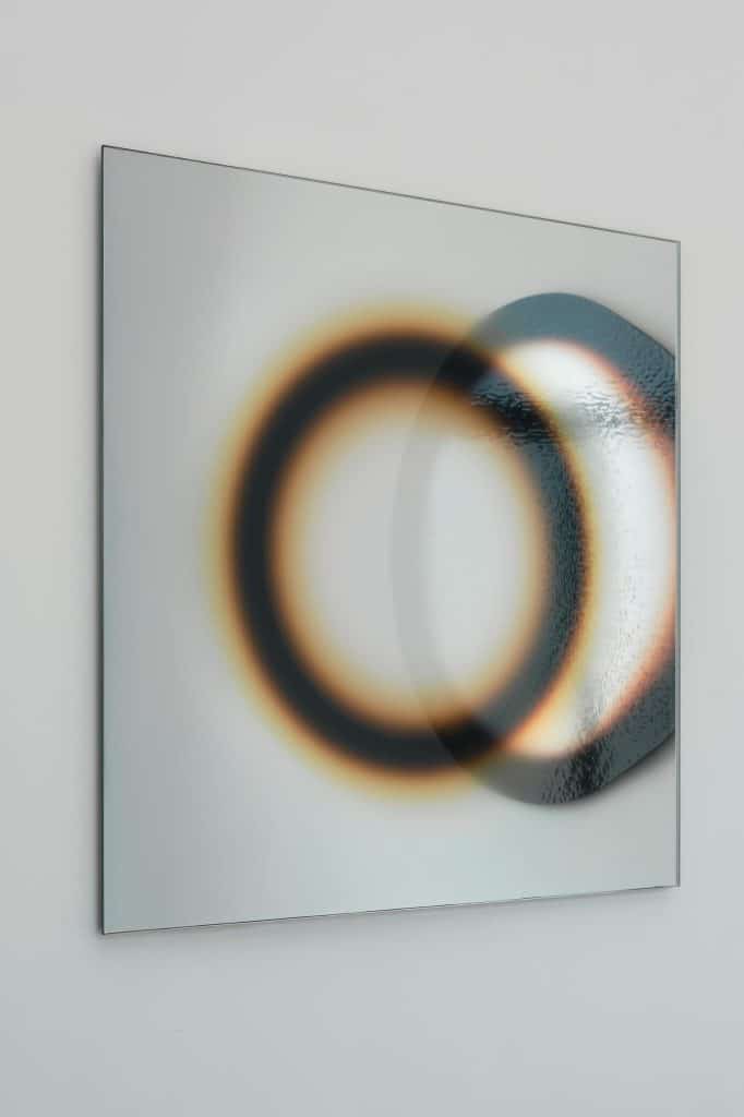 Costantino Gucci mirror work with layered glass reflecting fragmented light.