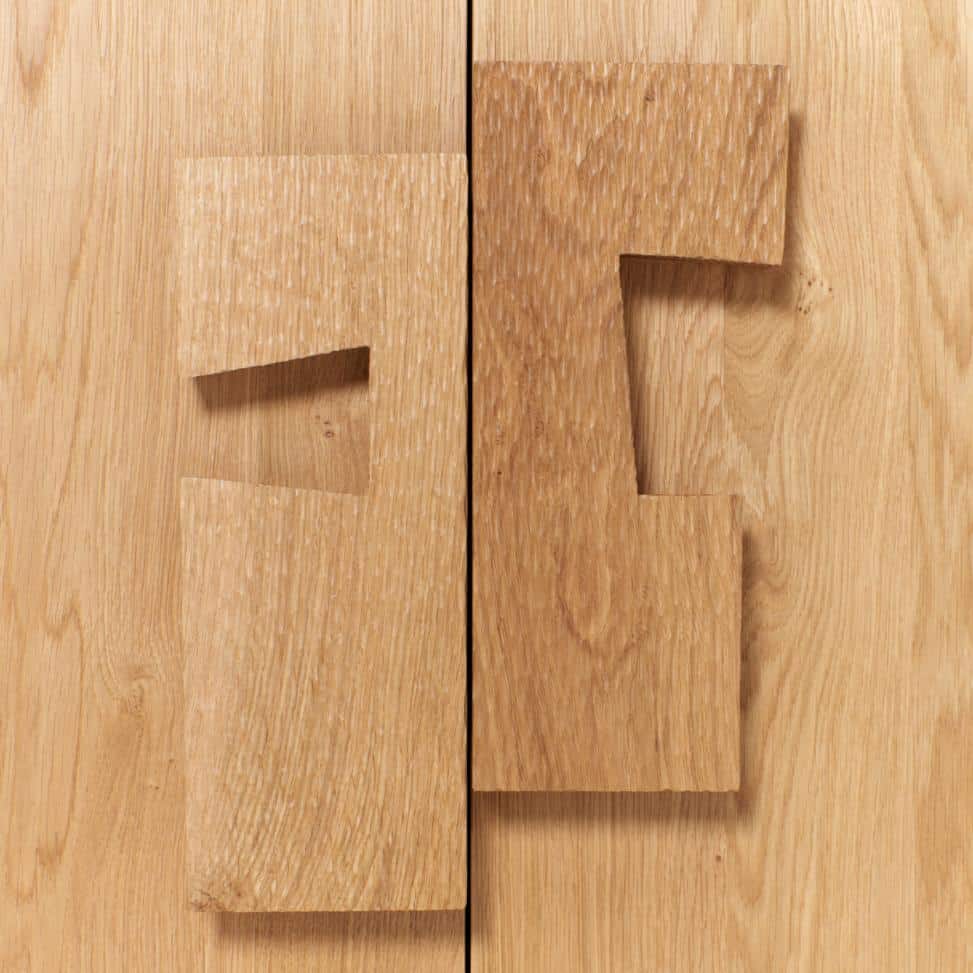 Close up of hand carved wooden doors