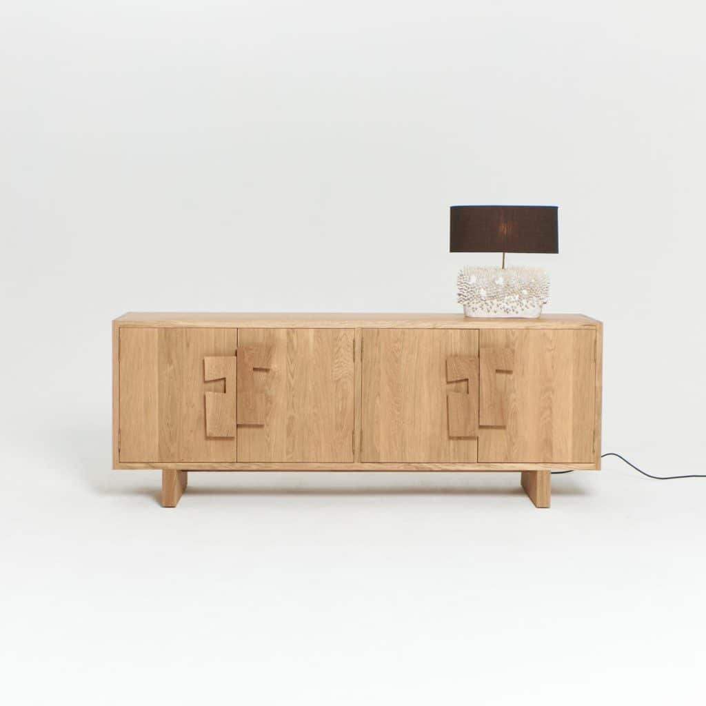 Side view of solid oak credenza with textured design details