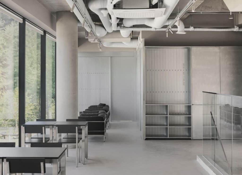 Galvanized vertical pipes inside NTBR café as architectural metaphor of process