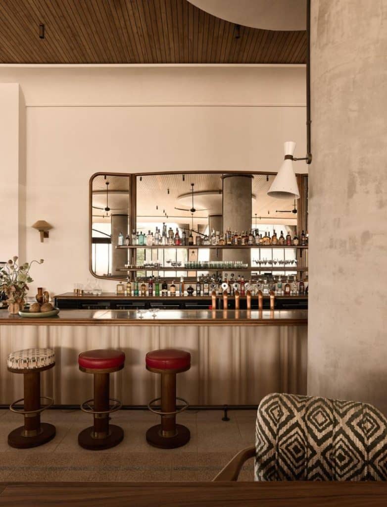 Lobby bar at Mondrian Gold Coast with pre-cast concrete curtain and walnut detailing