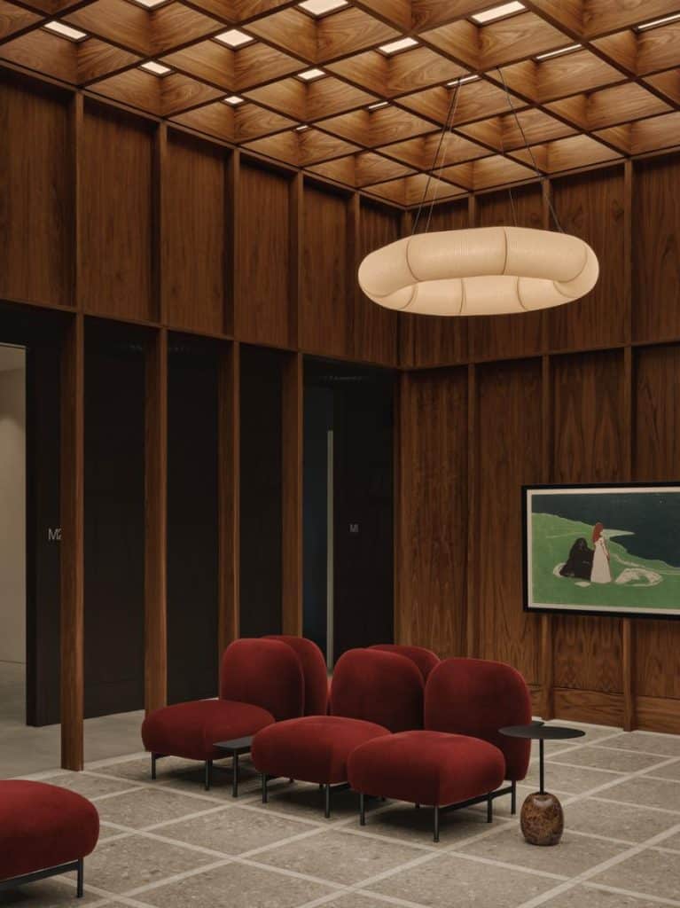 OAKV by Atelier Carle reception area with walnut cladding and natural light