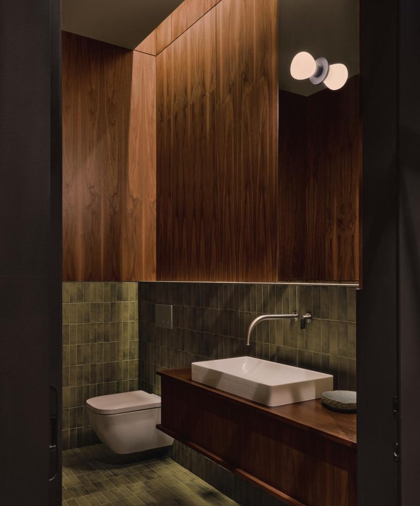Material detail showing walnut panels and subtle light reflections
