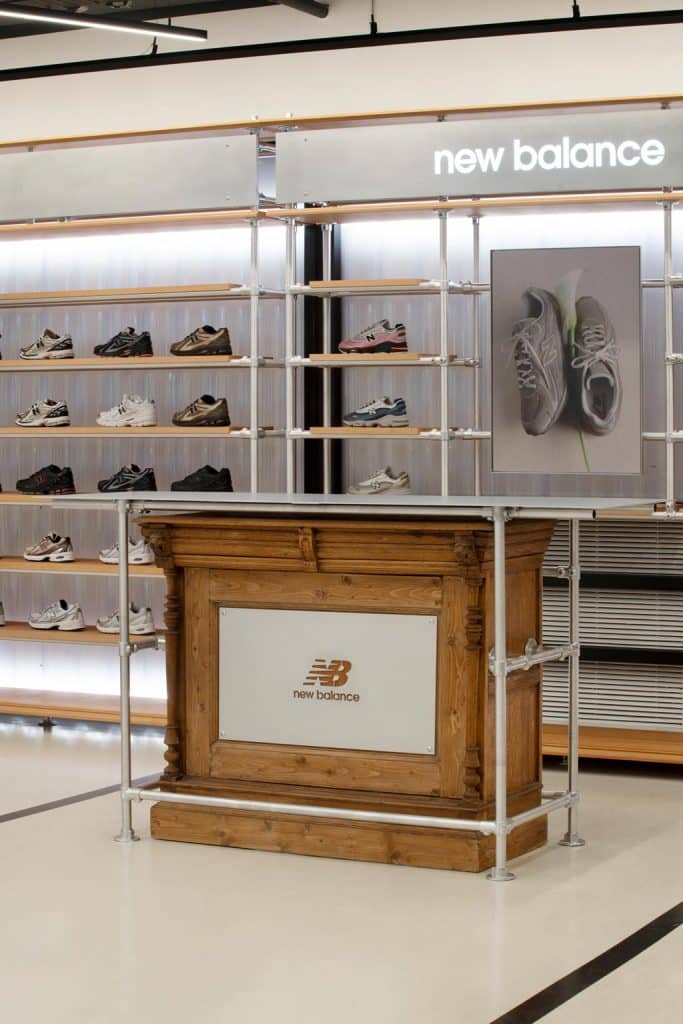 Reworked vintage wardrobe serving as a shoe display at New Balance Citadium Paris
