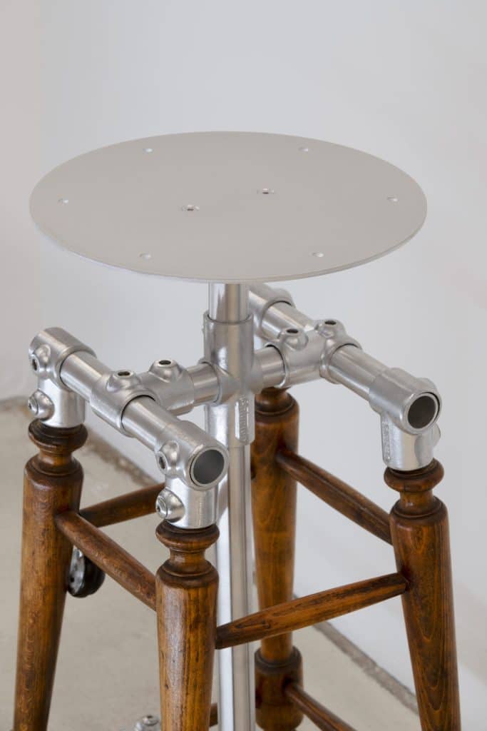 Detailed view of metal framework added to century-old wooden furniture