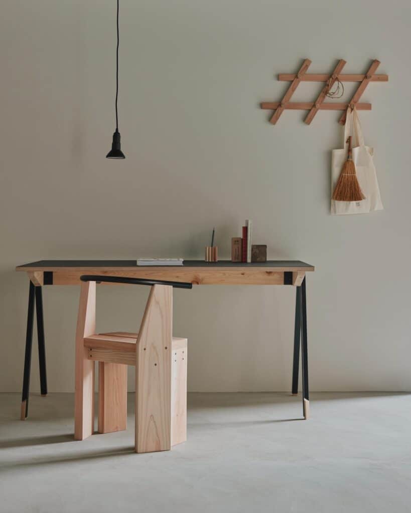 Minimal interior composition featuring Hiroi Chair as a focal furniture piece