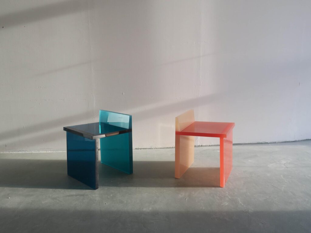 Taupe and orange Lucid Chair variation showing color transition through resin