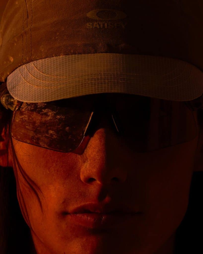 Stunt Devil eyewear resting on desert rock under shifting light