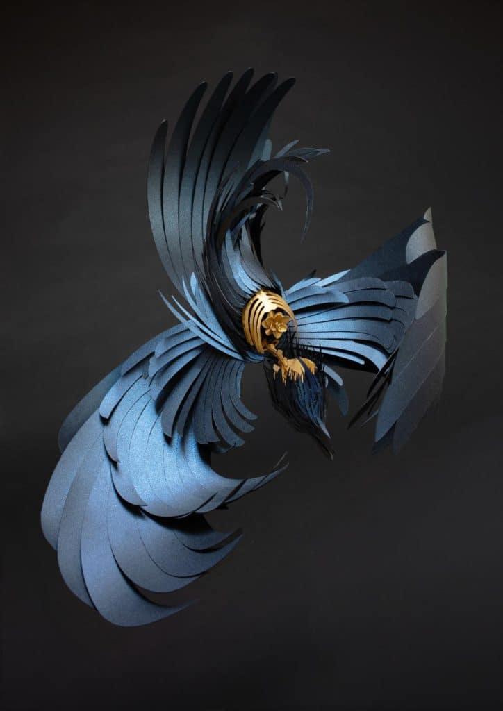 Lisa Lloyd paper sculpture of a bird with layered feathers in vibrant colors