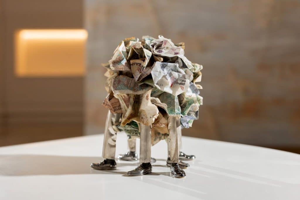 Layers of international banknotes sealed within the Old Money Diamond Age sculpture