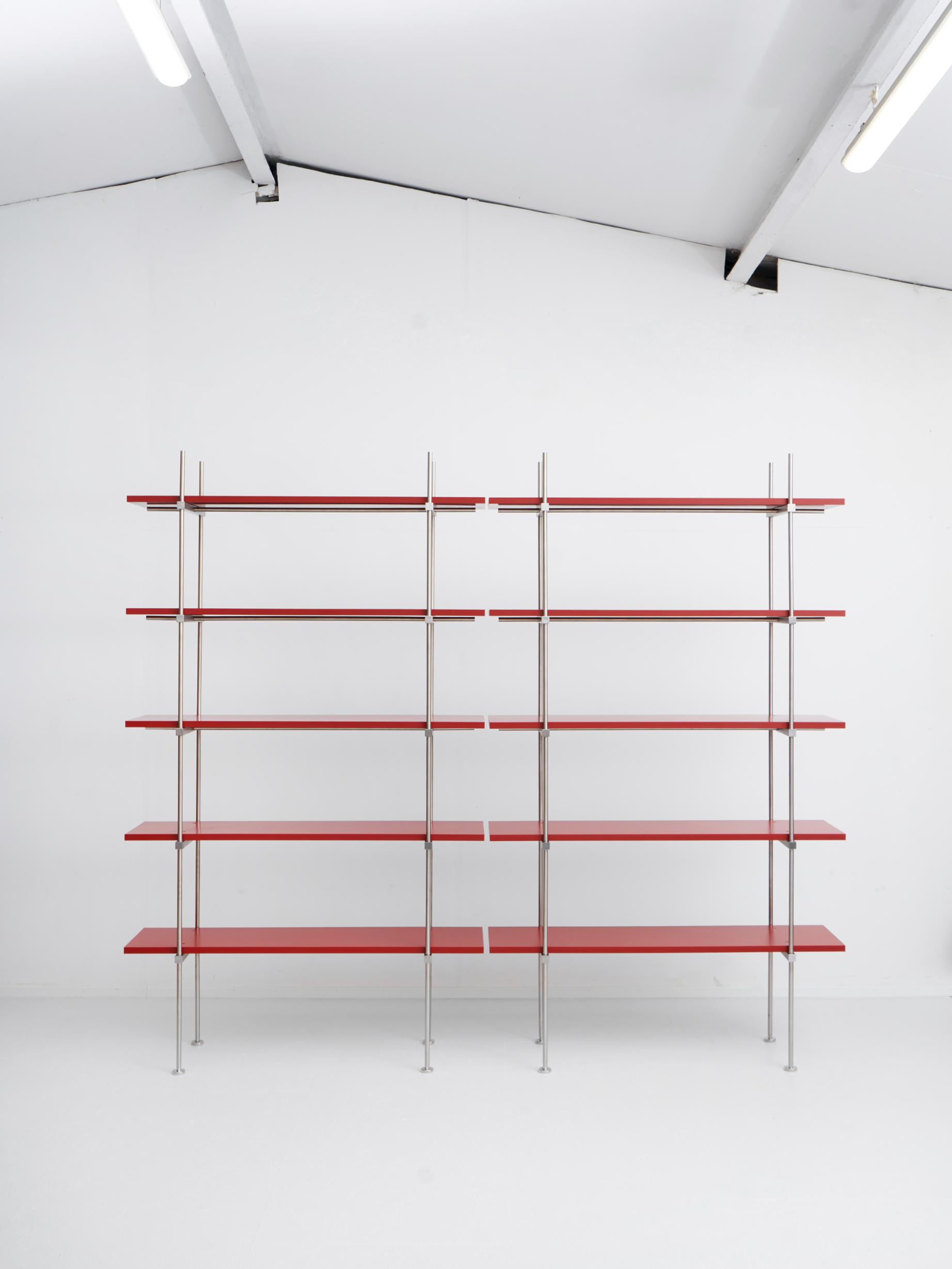 Two separate shelf sections forming a low horizontal arrangement against a wall