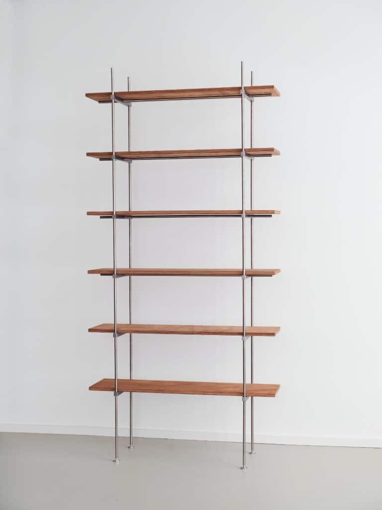 The Spaghetti Shelf System with thin stainless steel rods supporting light plywood shelves