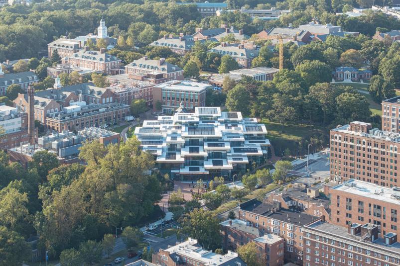 Exterior view of Bloomberg Student Center with timber pavilions and glass façade