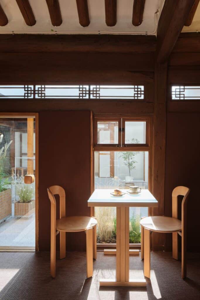 Interior view showing harmony between traditional beams and minimal furnishings