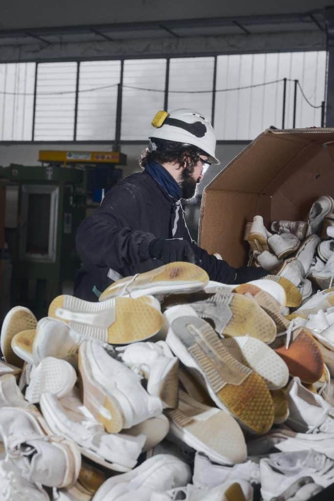 Factory setting with leftover shoe materials prepared for reuse in the production process