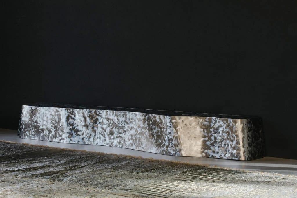 Shimmering woven carpet by Nathalie Van der Massen inside the living hall