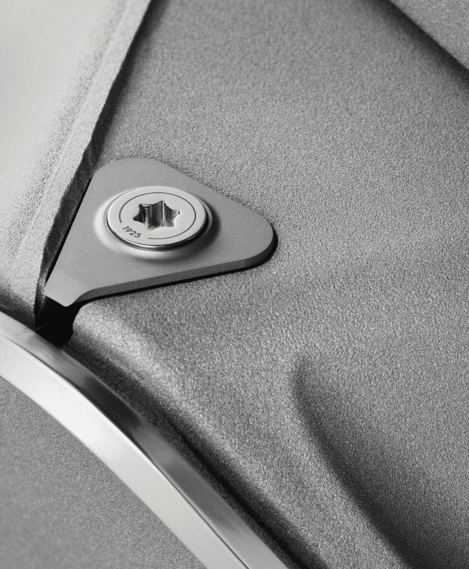 Close view of aluminium rings framing each woofer