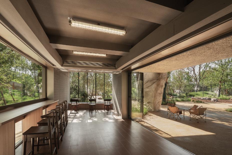 Café area inside the dome structure with open views to surrounding greenery