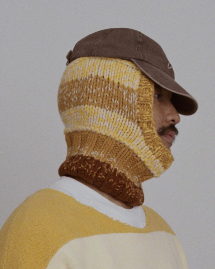 Close view of fleece sweater with yellow linear accents