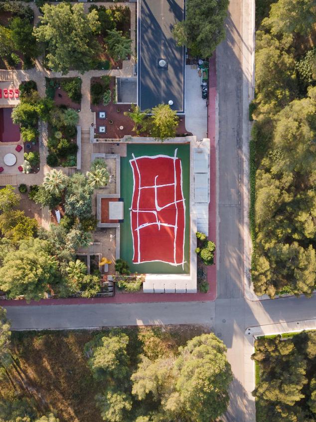View of Casa Axis architecture framing the custom tennis surface