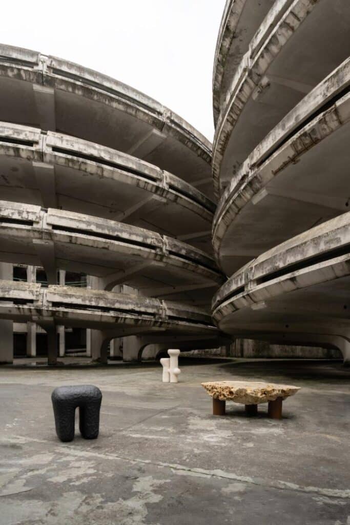Sculptural installation framed by the concrete spirals of Jacques Kalisz’s Mont d’Est parking