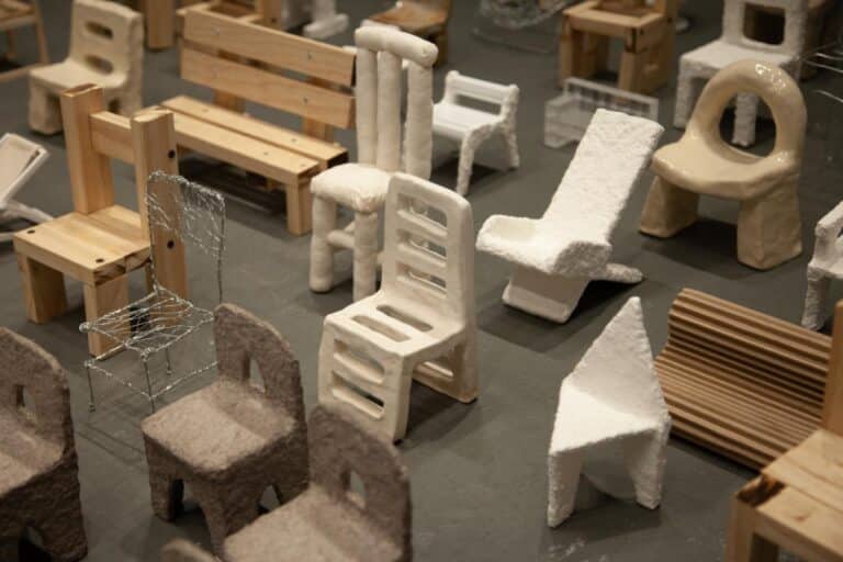 QiQi Chairs Fair by Qi Liu reflects on women’s identities Grouping of wooden chairs highlighting varying structures and tones