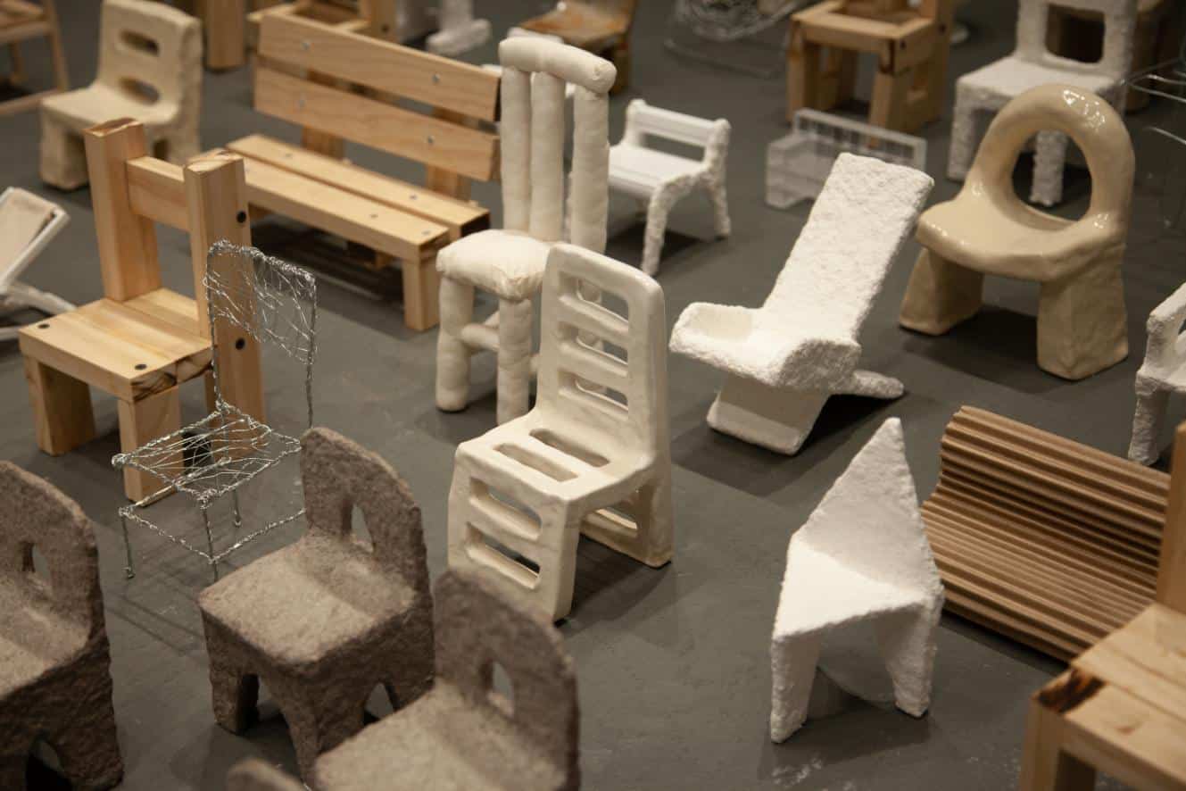 Grouping of wooden chairs highlighting varying structures and tones