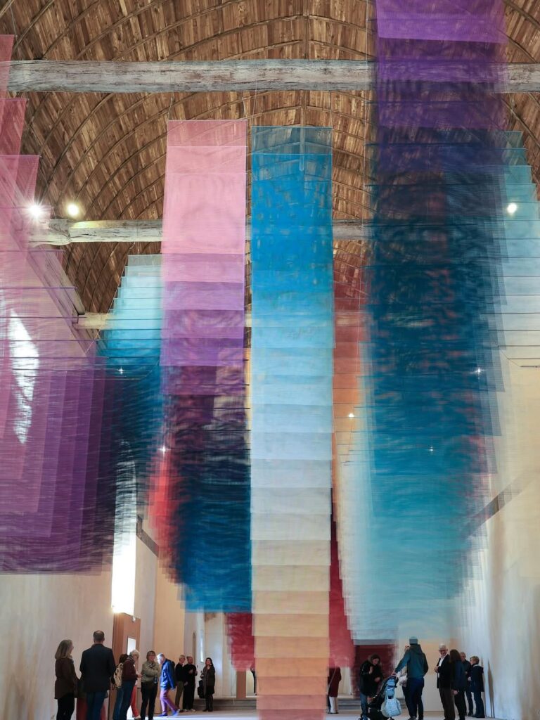 Wide view of the chapel transformed into a chromatic environment by Echoverse