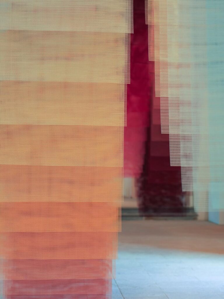 Close-up of overlapping fiberglass surfaces producing soft gradients