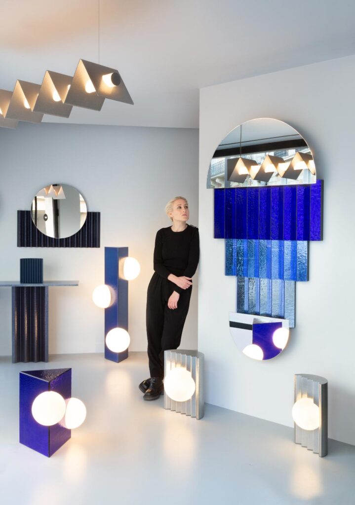 Victoria Wilmotte inside Paris showroom showcasing curated design objects