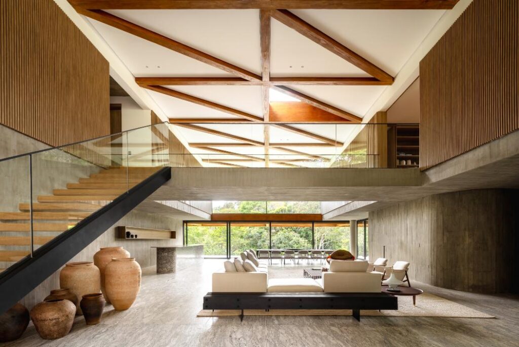 Living room interior with wide glass panels facing the lake