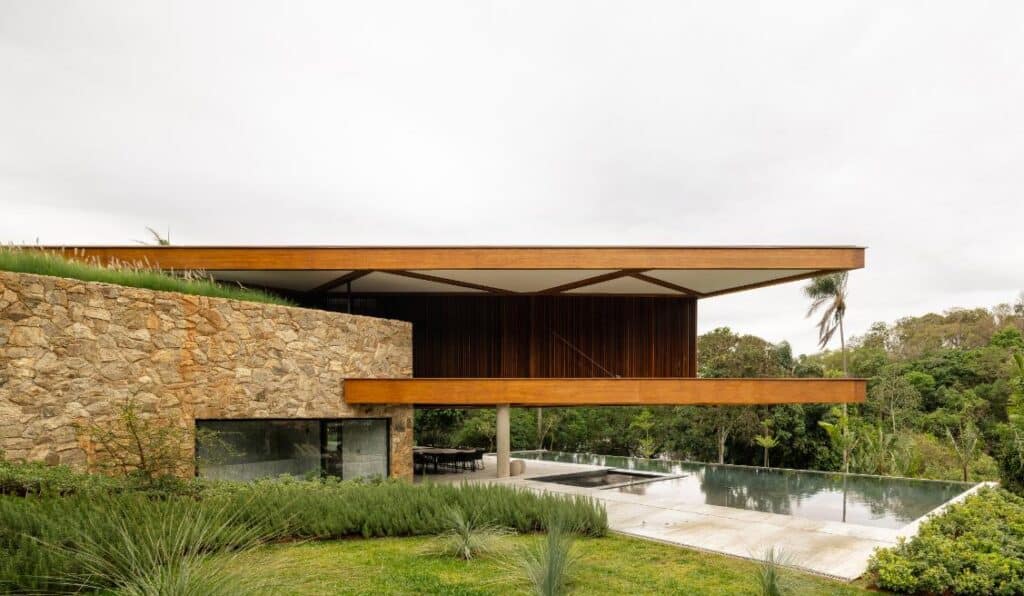 Timber roof planes forming angular geometry above the living spaces