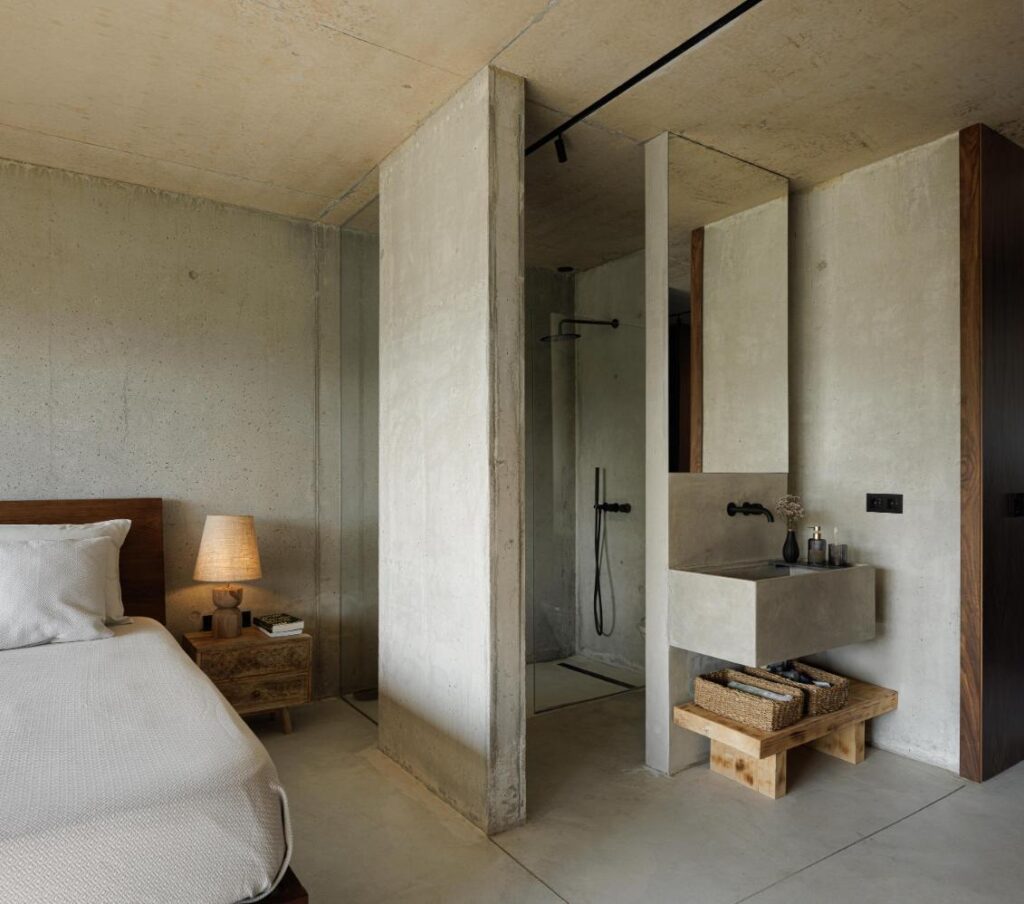 Casa Corten by HPA Arquitetura on a sloped industrial site -