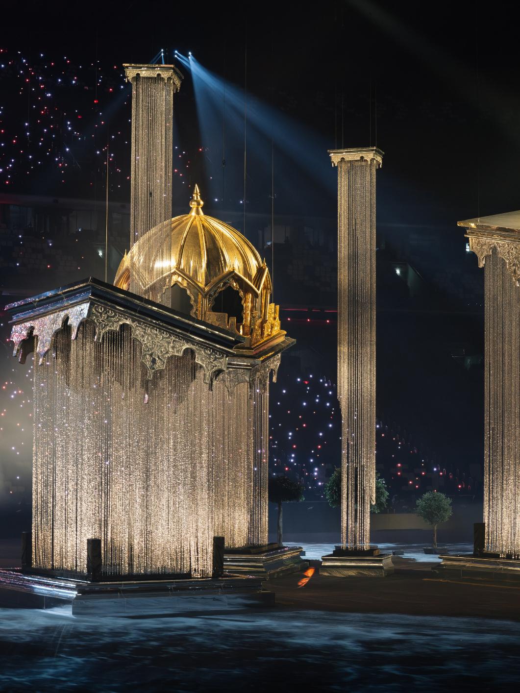 Custom platforms transporting large scenic components across the stadium floor