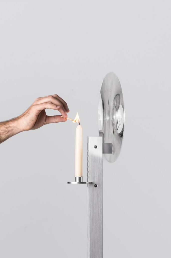 Close view of lens element capturing shifting candle glow
