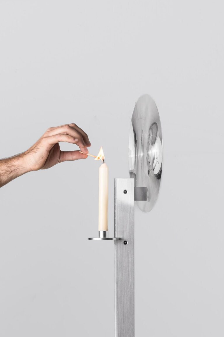 Close view of lens element capturing shifting candle glow