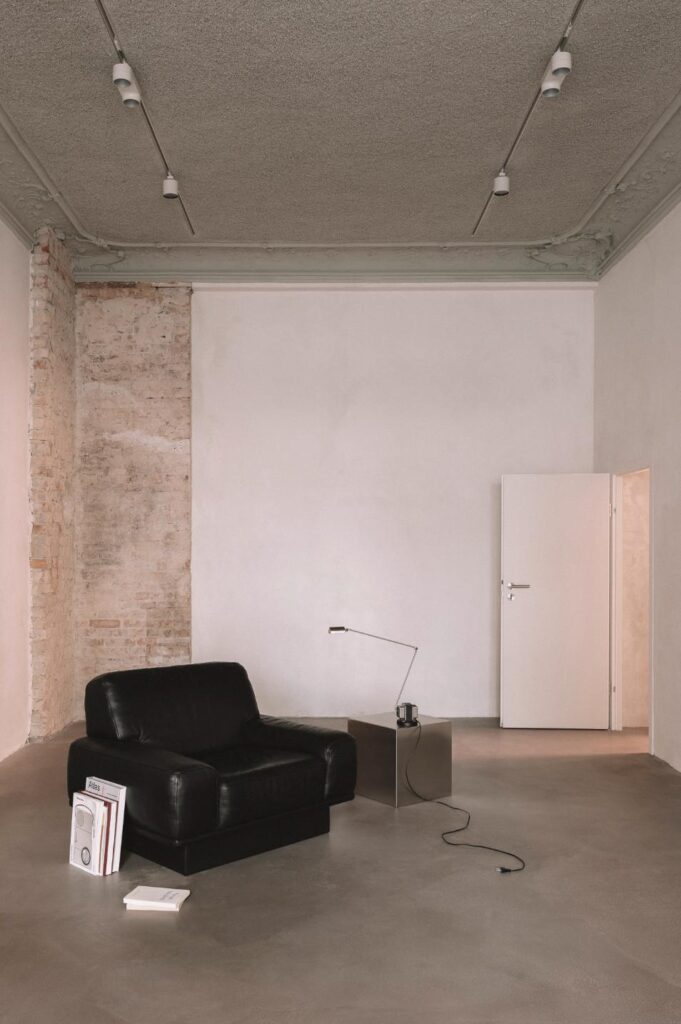 Exposed stucco and uneven plaster surfaces revealed during YONT’s transformation of Torstrasse 220