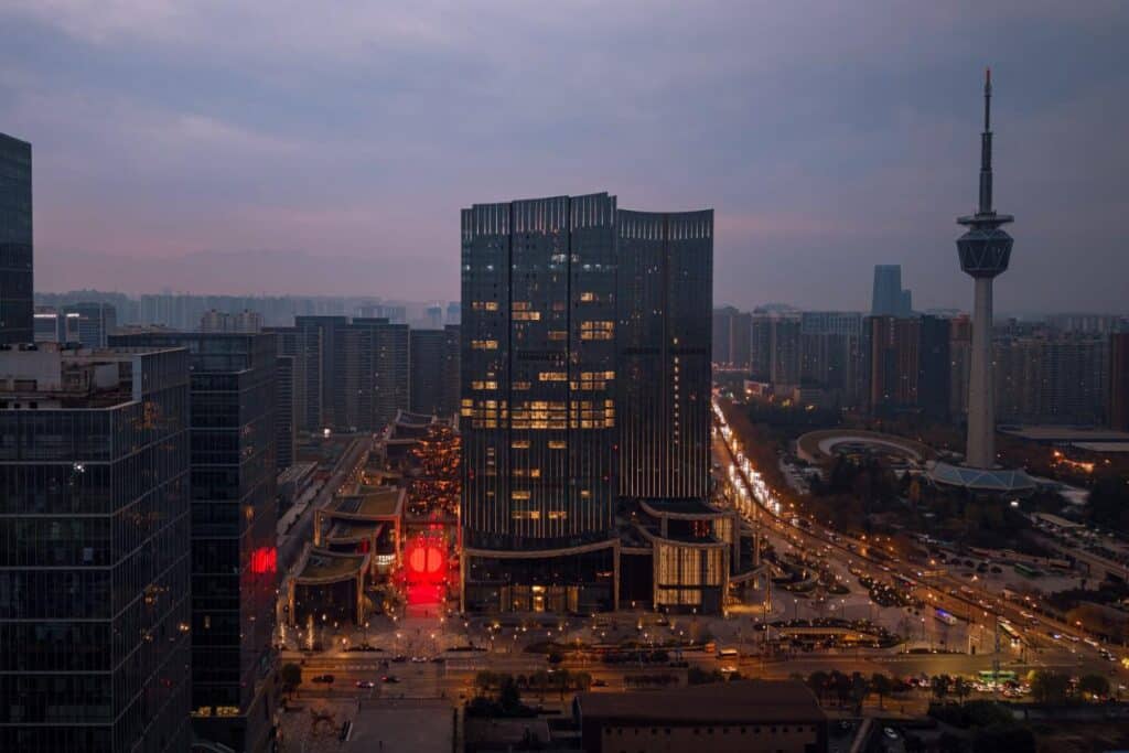 Red light illuminating the urban site around the installation