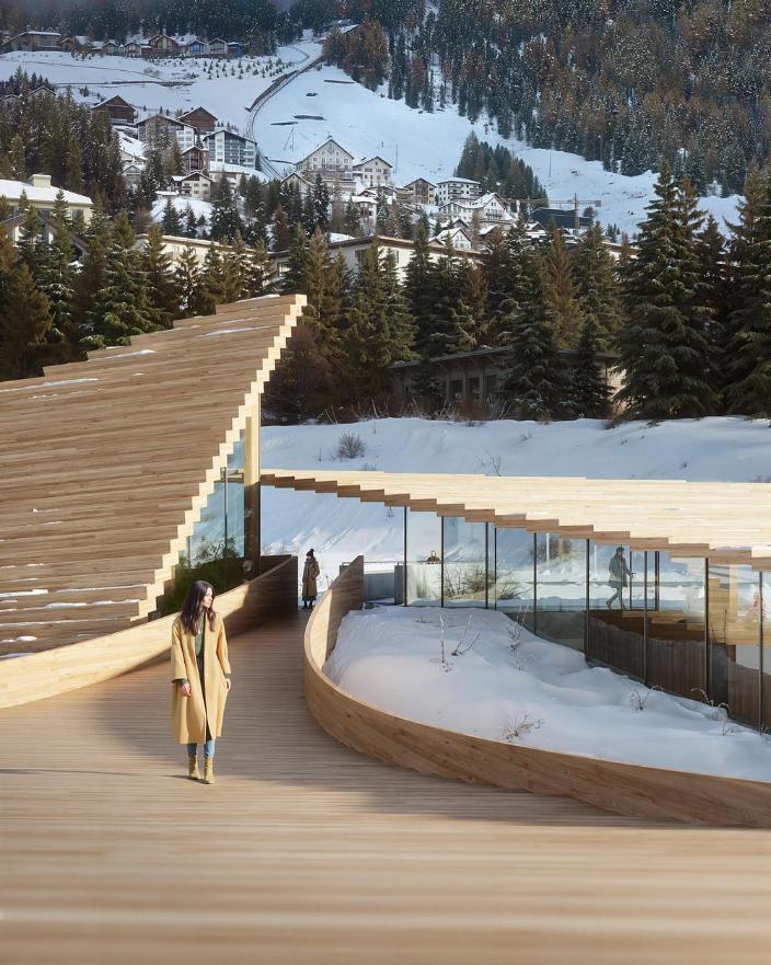 Sloping roofline following the alpine topography near the lake