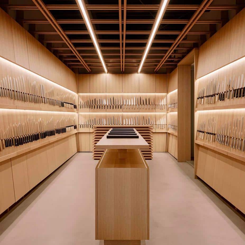 Warm wooden interior with knives positioned on timber panels