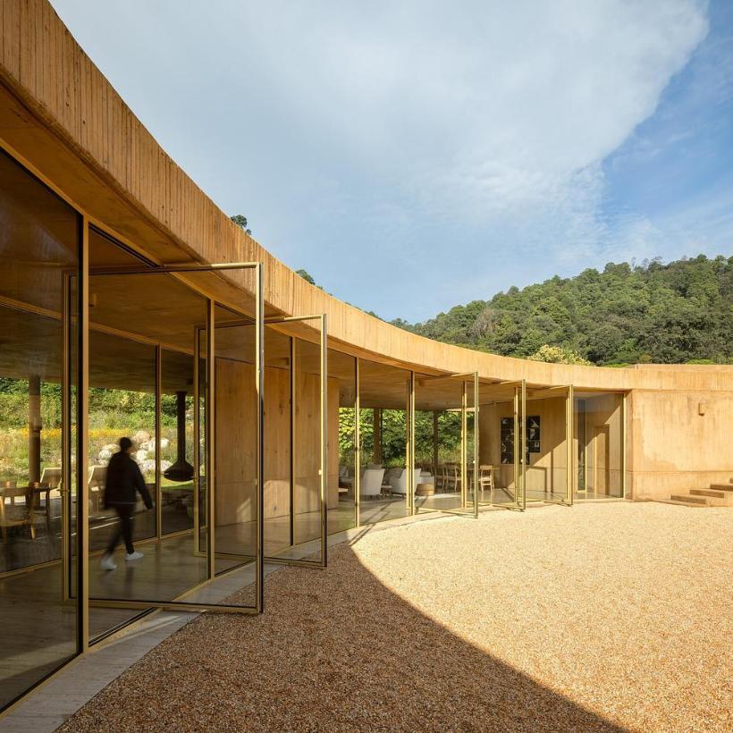 Exterior view of circular house set in remote Mexican valley
