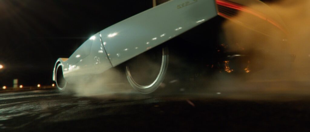 Close automotive CGI detail highlighting metallic texture and engineered surfaces