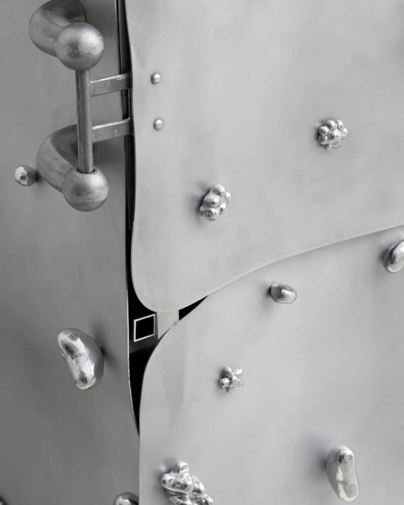 Close view of hand cast aluminum hardware fastening pipe joints