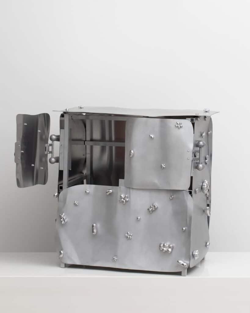 Aluminum panels attached to modular pipe frame with sculpted fittings