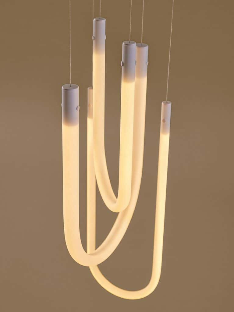 VARMBLIXT pendant shifting from cool daylight to warm yellow tones
