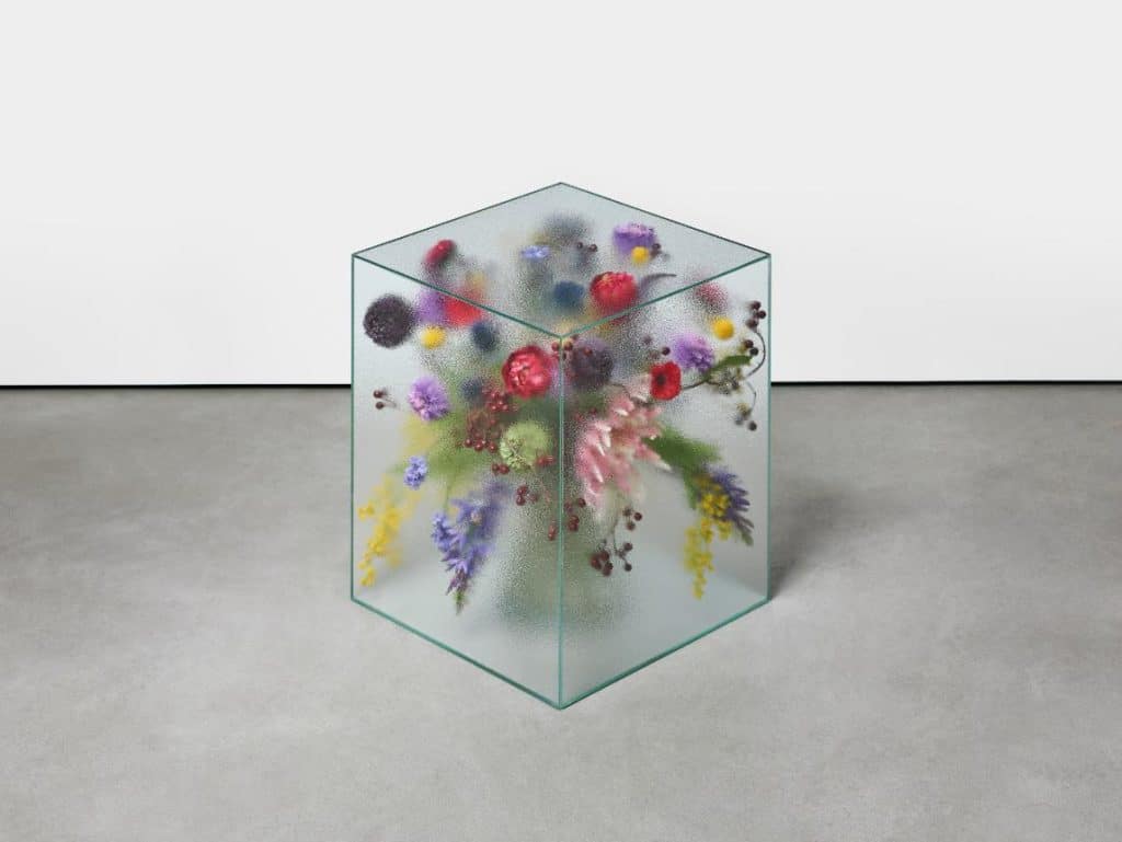 Flowers positioned behind translucent glass segments