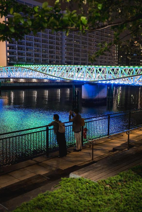 Night view with programmable coloured lighting along bridge form