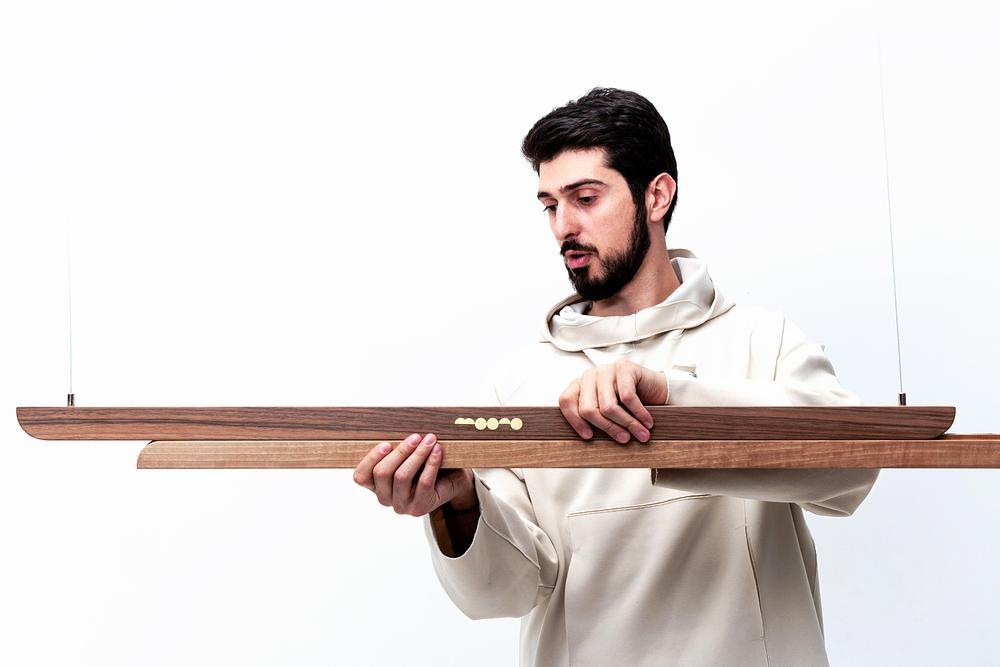 Moono sliding pendant light introduces tactile lighting design -