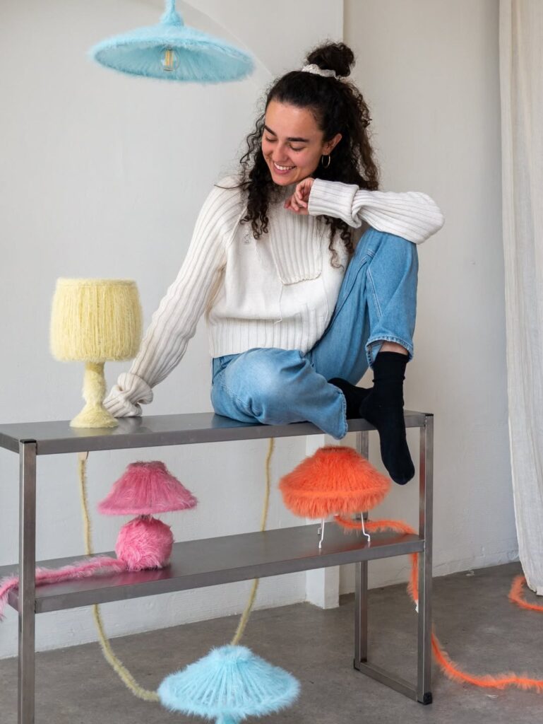 Nelly Bellegarde seated with cream pink orange and blue Furry Lamps by napalosa_ in studio portrait
