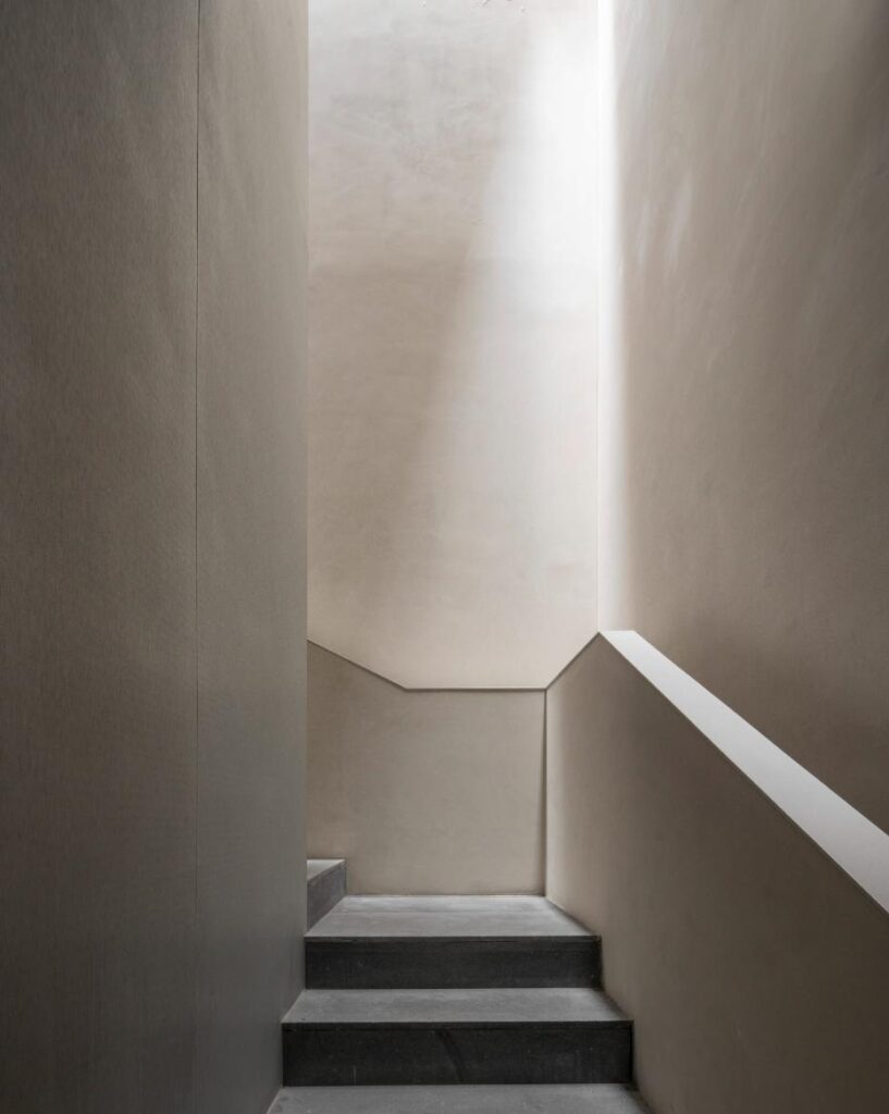 Central skylight illuminating metal clad staircase core